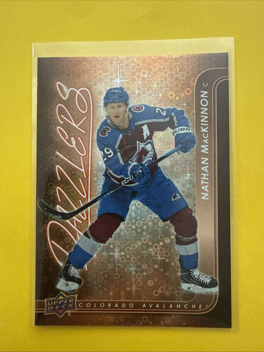 Nathan MacKinnon . 2024/25 UD Orange Dazzlers Card - front