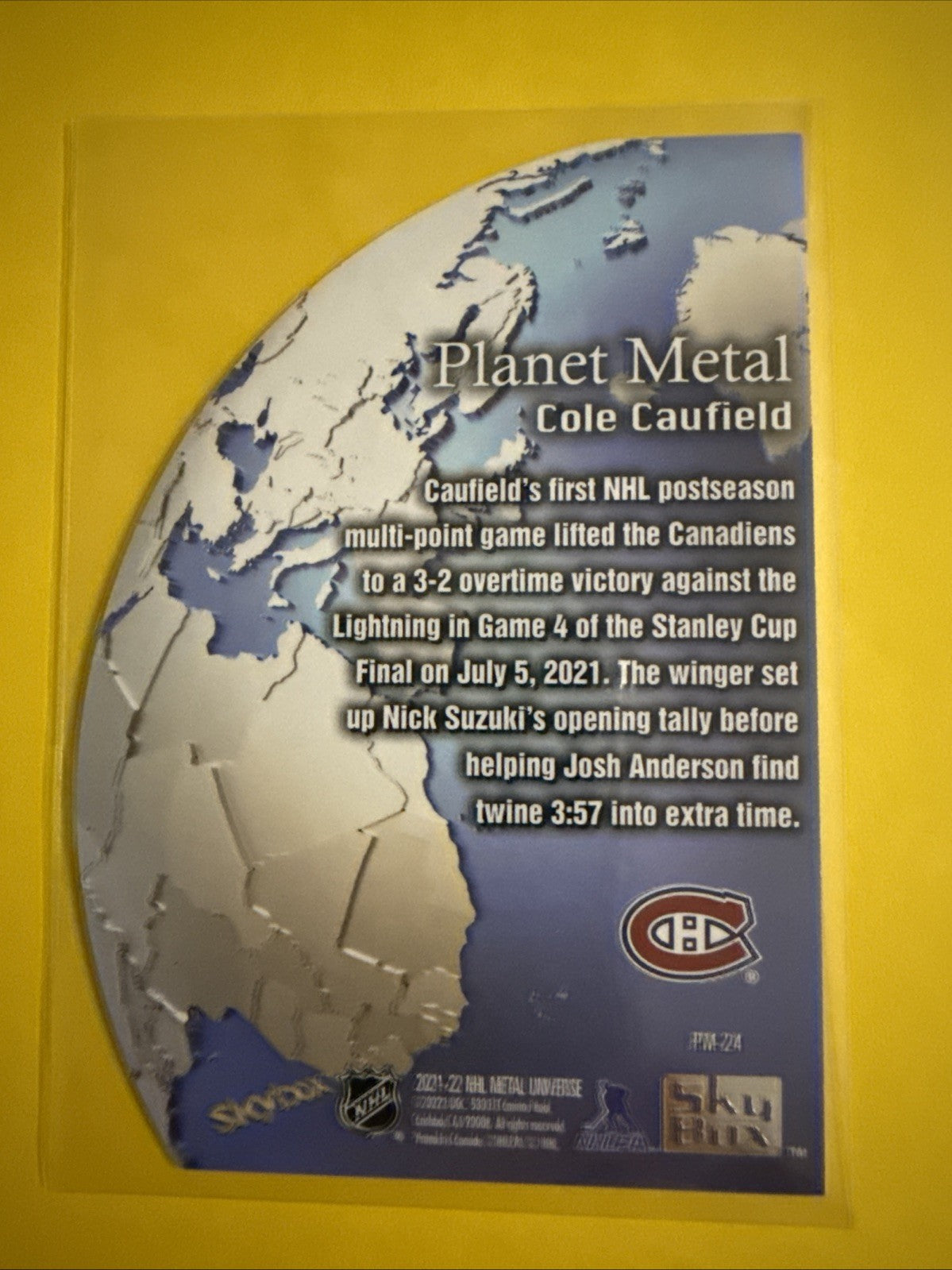 Cole Caufield 2021/22 Metal Universe Planet Rookie Card - back